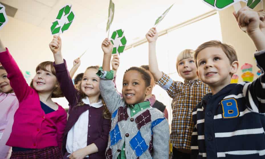 children holding recycling signs