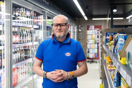 Cashier Garry Backhouse, 51, at the petrol station owned by Shailesh Parekh in Erdington, Birmingham.