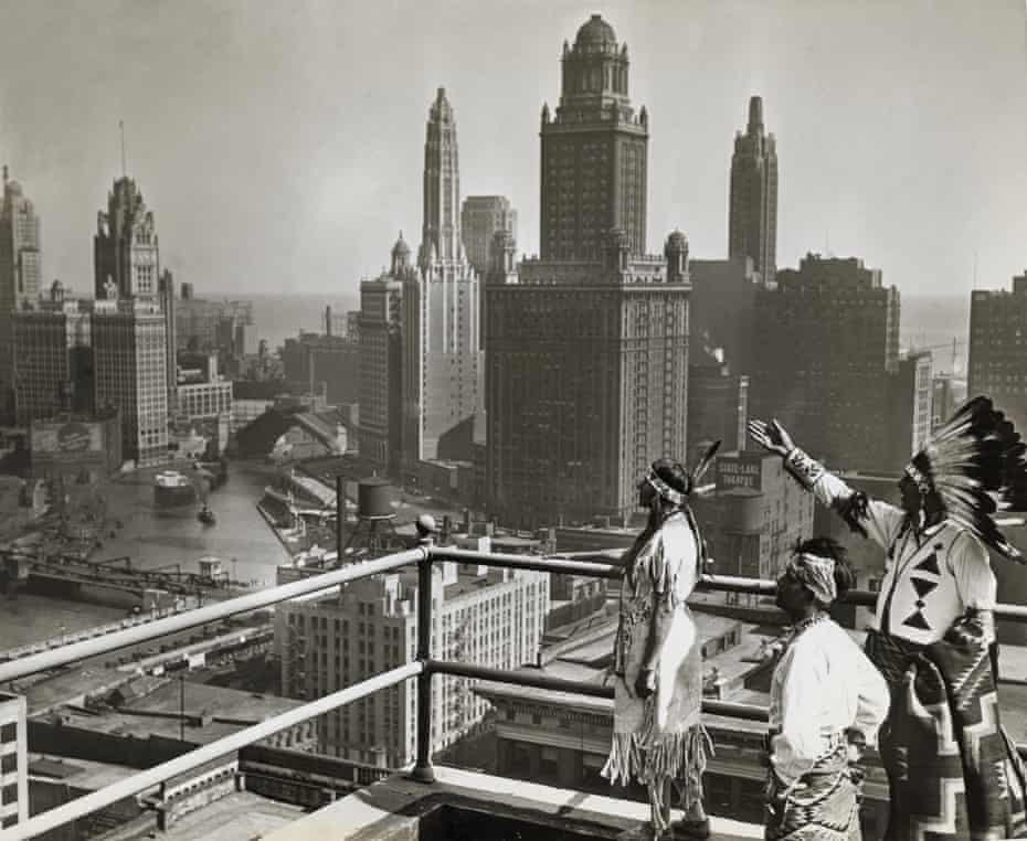 Native Americans look out over Chicago’s skyline.