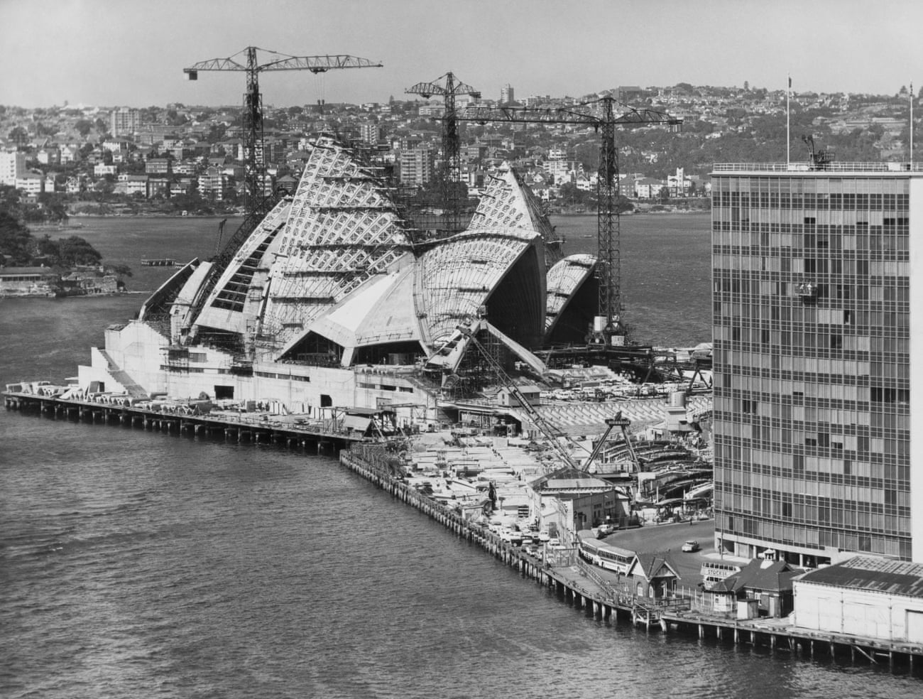  Building an icon: cranes rise above the harbour during the construction of the Sydney Opera House.