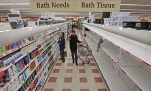 Shelves that normally contain toilet paper at Market Basket grocery store in New Bedford, Massachusetts, are stripped bare.