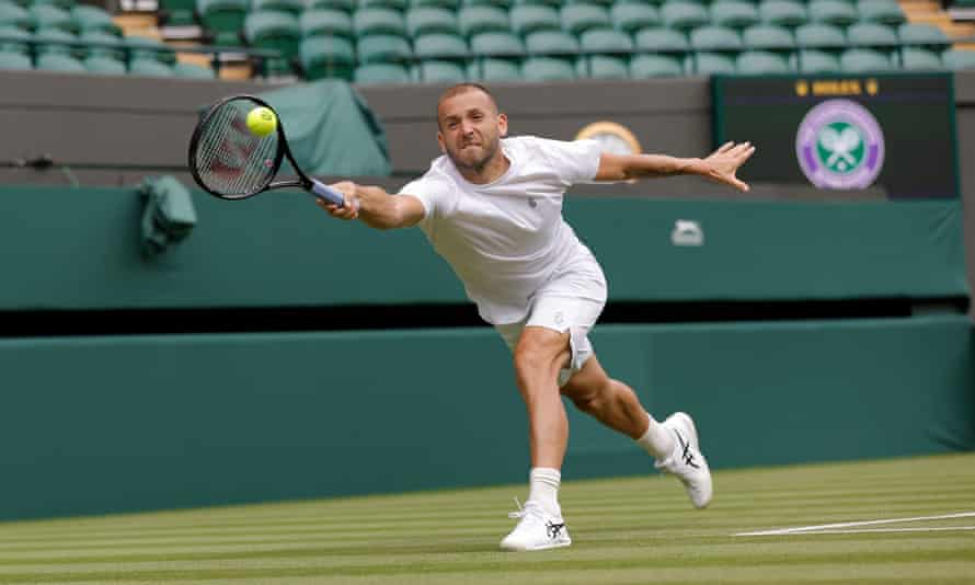 Dan Evans stretches for a return during a training match on Court 1 with Andy Murray.