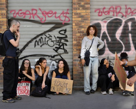Students are seen sitting down during protests in Paris, France.