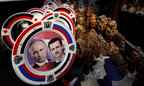 Porcelain plates with portraits of the Syrian president, Bashar al-Assad, right, and his Russian counterpart Vladimir Putin displayed at a handicrafts shop in Damascus.