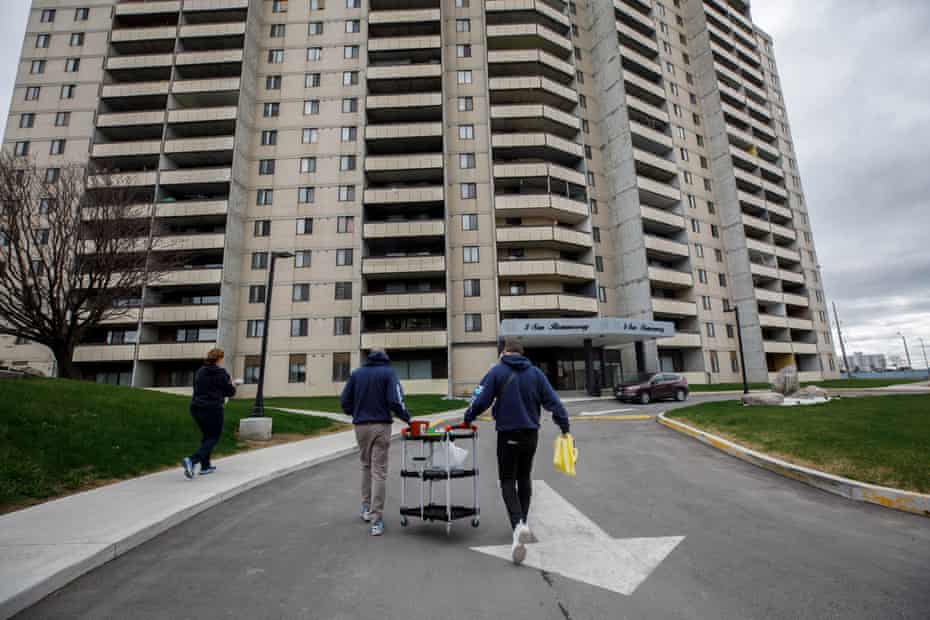 Ruben Rodriguez and his team prepare to administer doses of the Moderna vaccine to residents of San Romanoway towers.