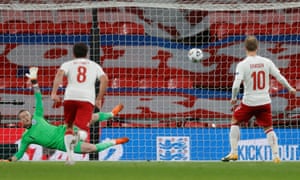 Denmark’s Christian Eriksen scores their first goal from the penalty spot.