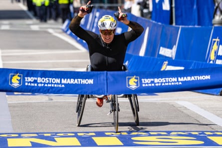 Eden Rainbow-Cooper crosses the line as she wins the women’s wheelchair race at the Boston Marathon