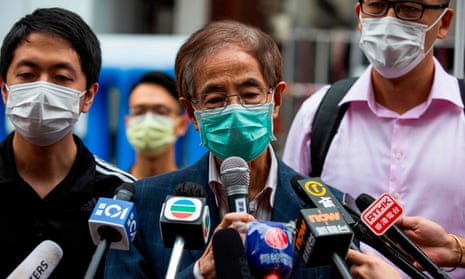 One of those arrested, former lawmaker and pro-democracy activist Martin Lee (centre) talks to the media after leaving the central district police station in Hong Kong.
