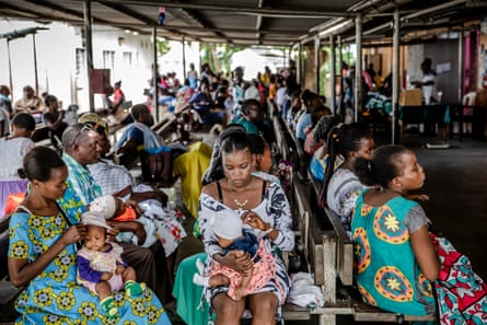 Mothers wait with their children for medical checkups at Junju Dispensary, Kilif.