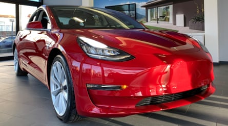 A Tesla Model 3 car on display at a Manchester showroom