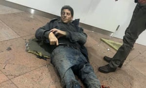 Brazilian basketball player Sebastien Bellin lies wounded on the floor of Zaventem airport in Brussels, Belgium.