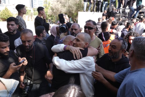 Palestinians released by Israel from Ofer Prison under the first phase of the ceasefire agreement are brought to Ramallah by buses of the Committee of the Red Cross.