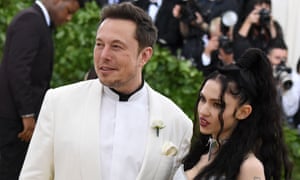 Elon Musk with his girlfriend Grimes at the Met Gala in May. On Wednesday Musk must once more explain to investors what is going on at Tesla.