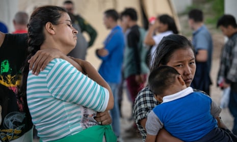 Immigrants seeking asylum are taken into custody by border patrol agents in McAllen, Texas.