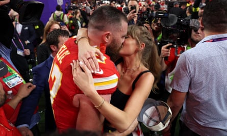 Travis Kelce and Taylor Swift embrace after the Kansas City Chiefs win the Super Bowl in Las Vegas.