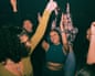 Cheerful young friends dancing and enjoying together at nightclubPosed by models
GettyImages-1461603754