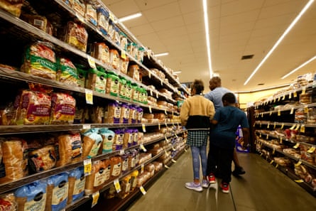 a family shops at a grocery store