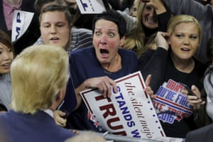 Massachusetts, USA: Audience member Robin Roy (C) reacts as U.S. Republican presidential candidate Donald Trump greets her at a campaign rally