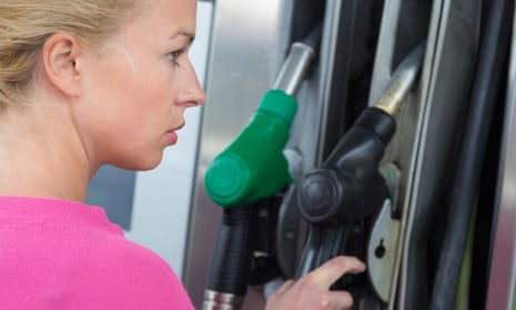 Woman at petrol pump