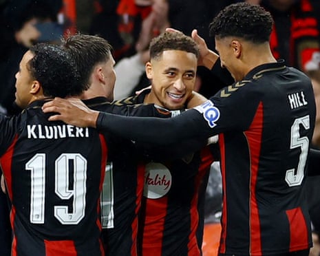 Marcus Tavernier smiles as Bournemouth teammates embrace him in celebration