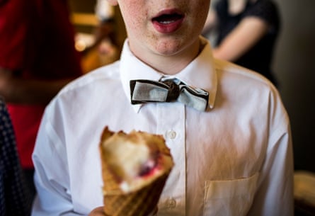 Boy eats his cone creative ice cream shop Salt &amp; Straw in Portland, Oregon,