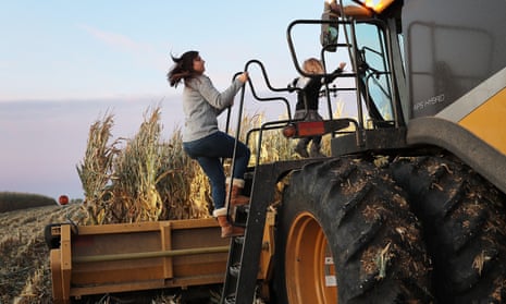 Iowa: First Battleground State In The Presidential Election<br>BAXTER, IOWA - OCTOBER 12: Ashley Schnieders and Arabelle Schnieders,3, join Troy Koehler as he drives a combine during the corn harvest in a field at the Hansen Family Farms on October 12, 2019 in Baxter, Iowa. The 2020 Iowa Democratic caucuses will take place on February 3, 2020, making it the first nominating contest in the Democratic Party presidential primaries. (Photo by Joe Raedle/Getty Images)