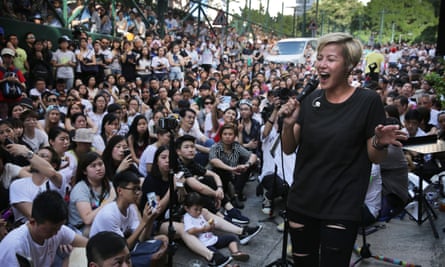 Denise Ho performs during a free concert in Hong Kong after cosmetics giant Lancome cancelled a concert featuring the local singer who is critical of China.