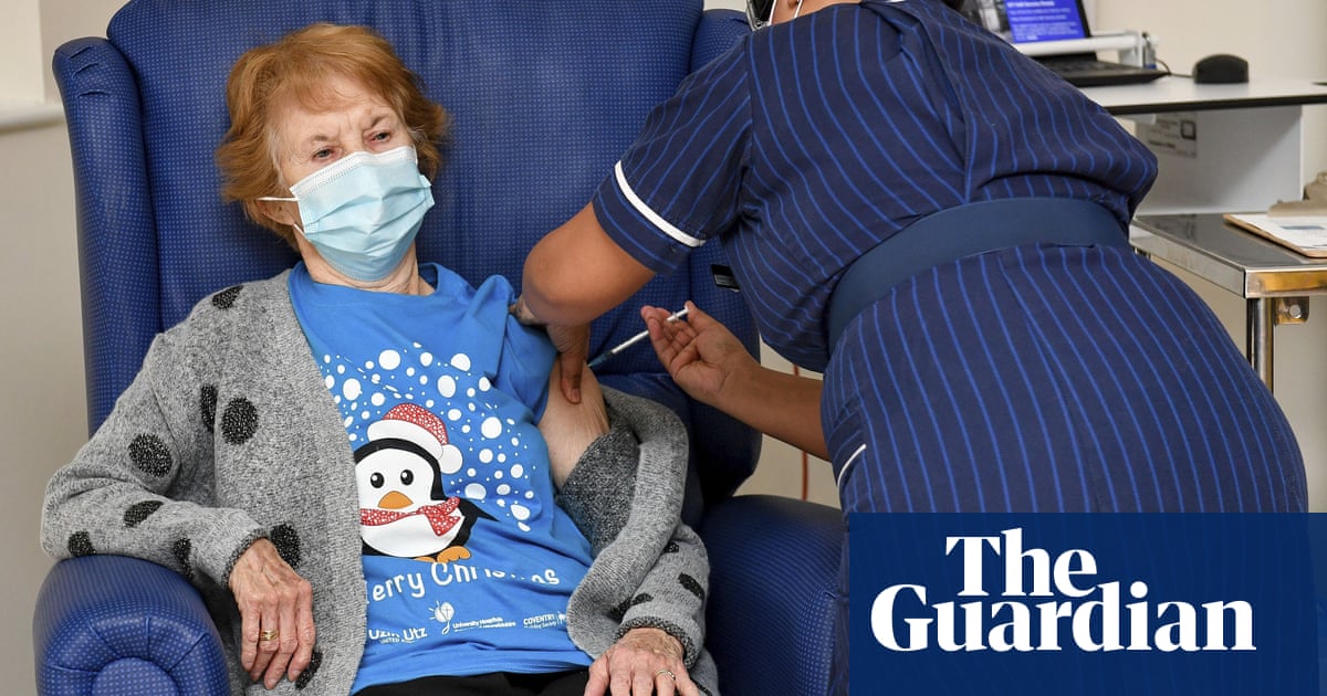 covid vaccine uk woman becomes first in world to receive pfizer jab coronavirus the guardian