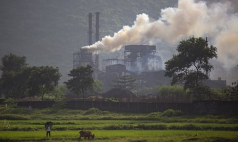 Smoke rises from a coal-powered steel plant in India.