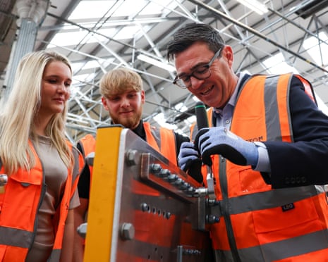 Andy Burnham, right, visits the Alstom factory in Derby on Tuesday