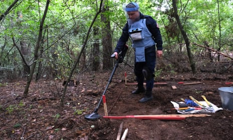A member of a mine clearance team working north-east of Kyiv.