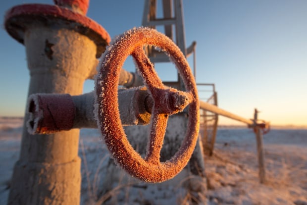 An oil pipeline covered in frost