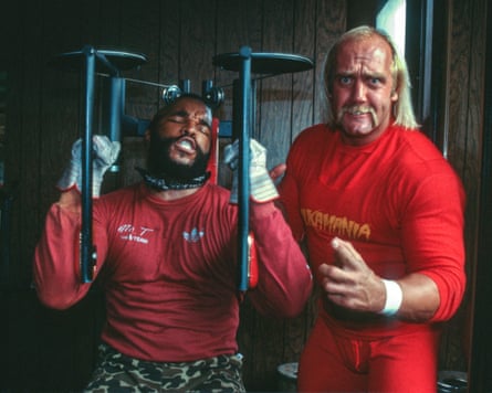 Mr T working out and Hogan poses next to him, dressed in red