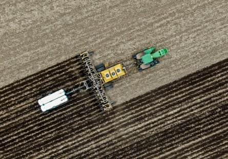 An aerial photo shows a farmer preparing his field for spring planting near Marengo, Illinois, US, April 2022