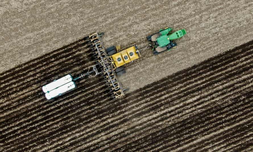 A farmer preparing his field for spring planting near Marengo, Illinois.