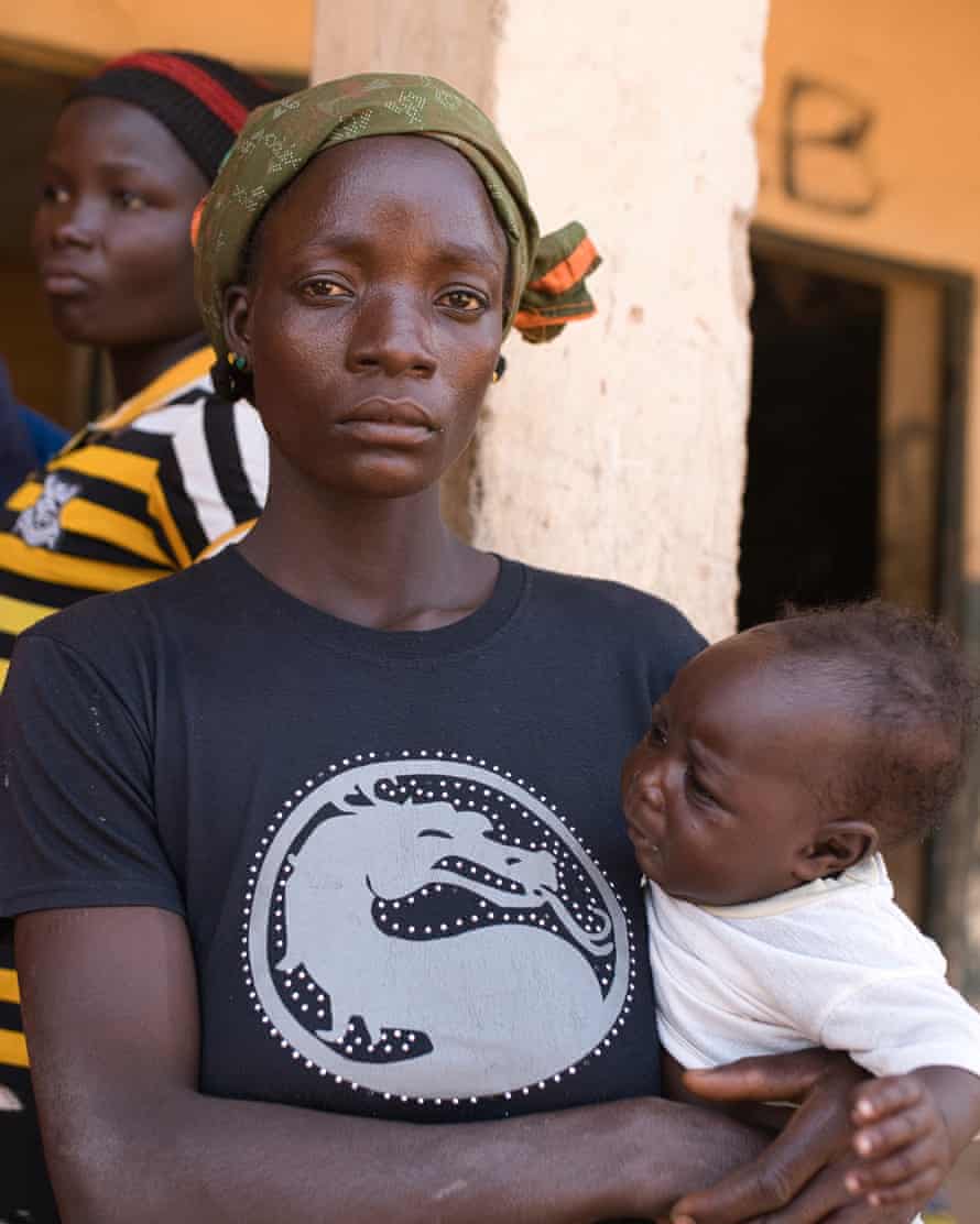 A woman and child among the displaced people at the Central Primary School in Gwada.