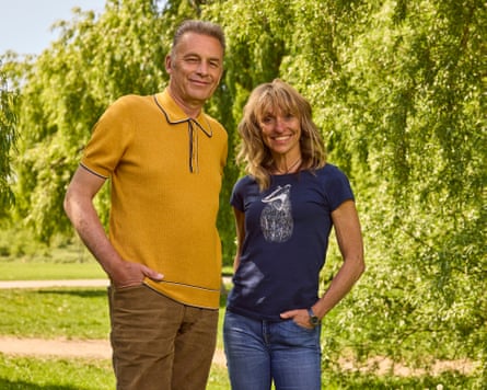 Chris Packham and Michaela Strachan in front of trees