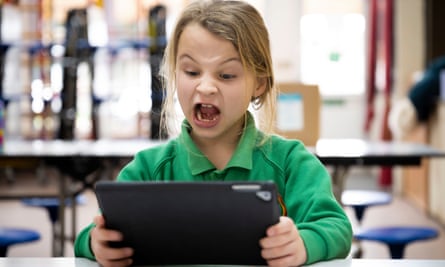 A schoolgirl using a tablet.