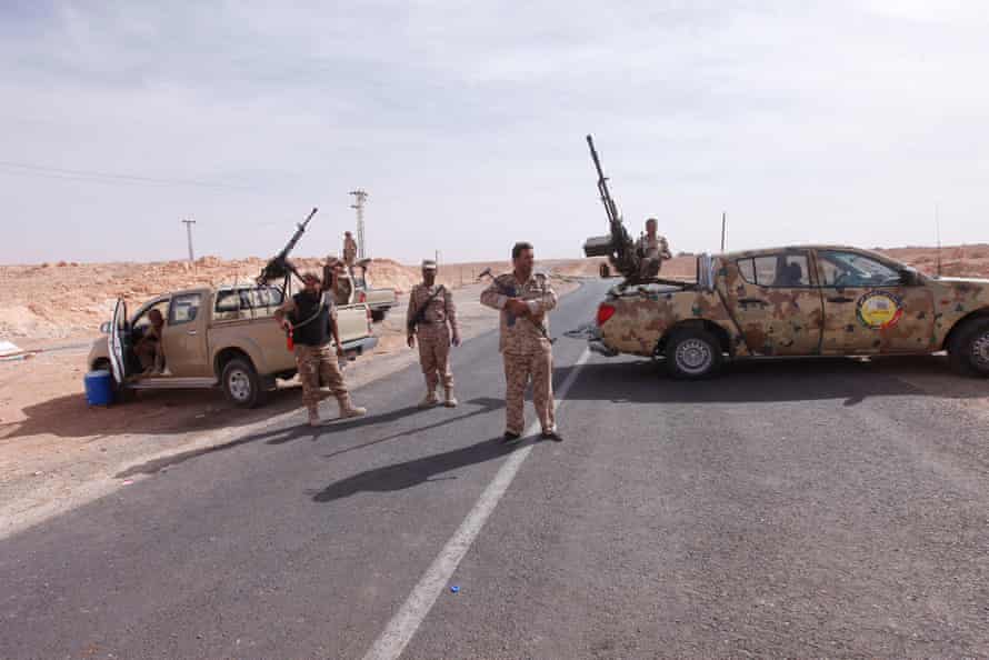 Libyan army forces form a checkpoint outside the city of Bani Walid, October 2012.