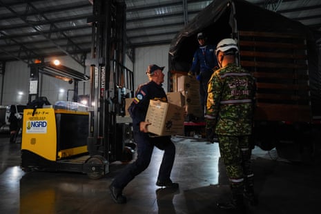 Members of the Colombian search and rescue team in Bogotá load a van with equipment to send aid to Venezuela.