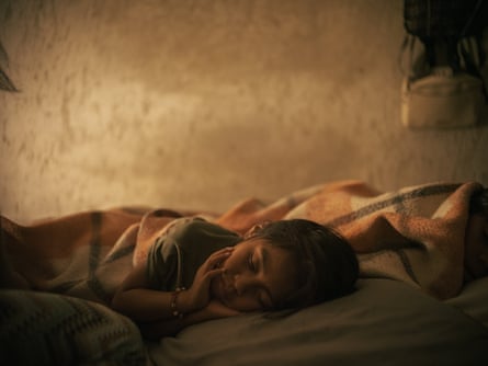Cristina Hernández (6), niece of Benjamín Ascencio Bautista, rests of her aunt’s bed