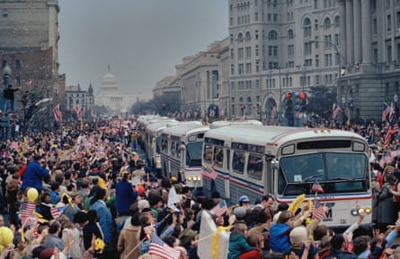 people standing by a bus