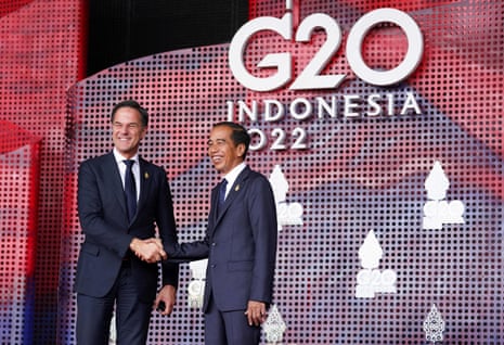 Indonesian President Joko Widodo greets Dutch Prime Minister Mark Rutte as he arrives for the G20 Leaders Summit.