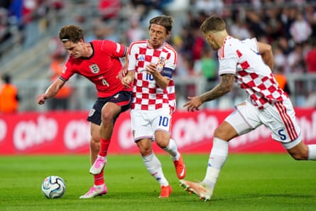 EnglandâÂÂs Alex Scott battles with CroatiaâÂÂs Luka Modric for possession.