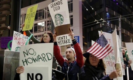 People protest outside before former Starbucks CEO Howard Schultz speaks during his book tour in Seattle, Washington, on 31 January.