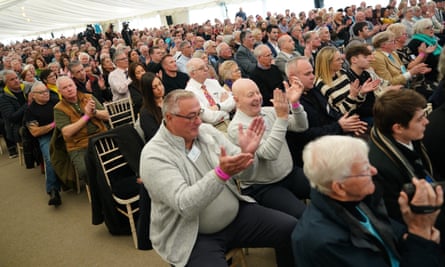 Reform UK members applaud party chair Zia Yusuf.