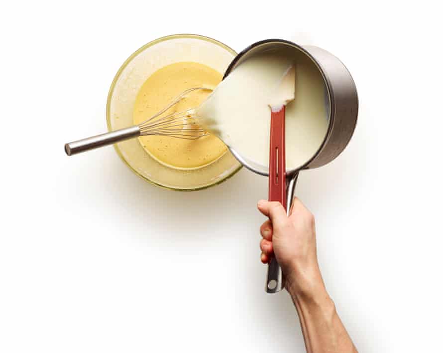 Felicity Cloake’s trifle STAGE 6. Pour about a third of the milk into a heatproof bowl, whisking vigorously as you go, then pour this mixture back into the milk pan, whisking the contents as you do so.