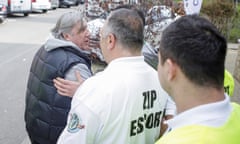 Romania’s head coach Ilie Nastase is escorted by stewards outside the arena in Constanta after his outbursts at the Fed Cup tie between Romania and Great Britain.