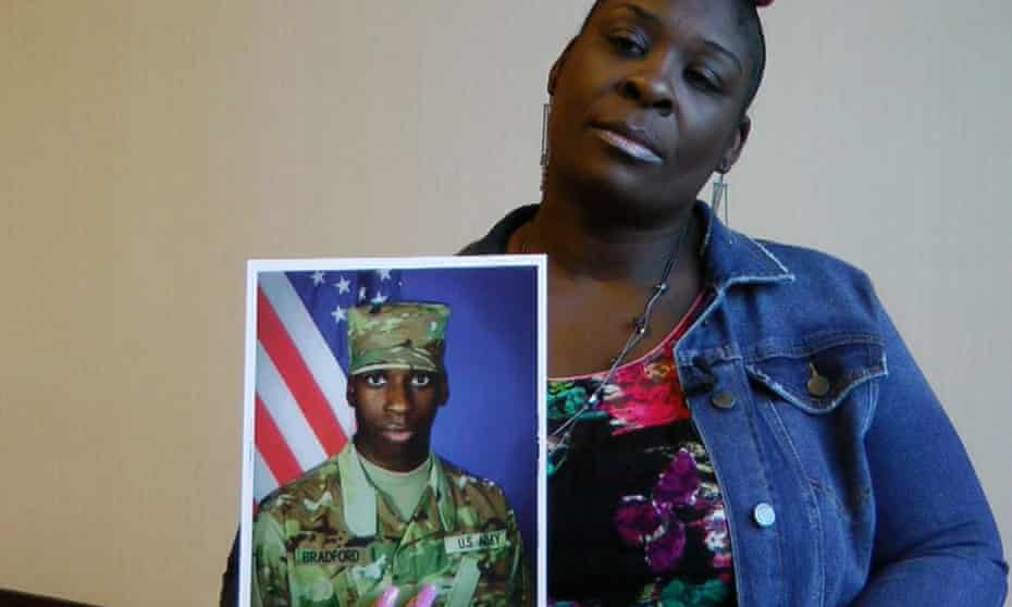 April Pipkins holds a photograph of her deceased son, Emantic Bradford Jr., during an interview in Birmingham on 27 November.