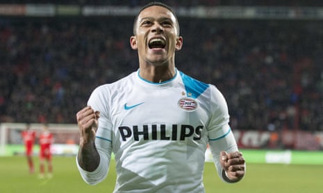 PSV Eindhoven’s Memphis Depay celebrates after scoring a goal against FC Twente.